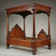 Antique wood and hardwood canopy bed