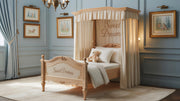 A luxurious teak wood children's bed with intricate carvings and a canopy, featuring white bedding and decorative pillows, placed in a room with blue walls and framed pictures on the wall.